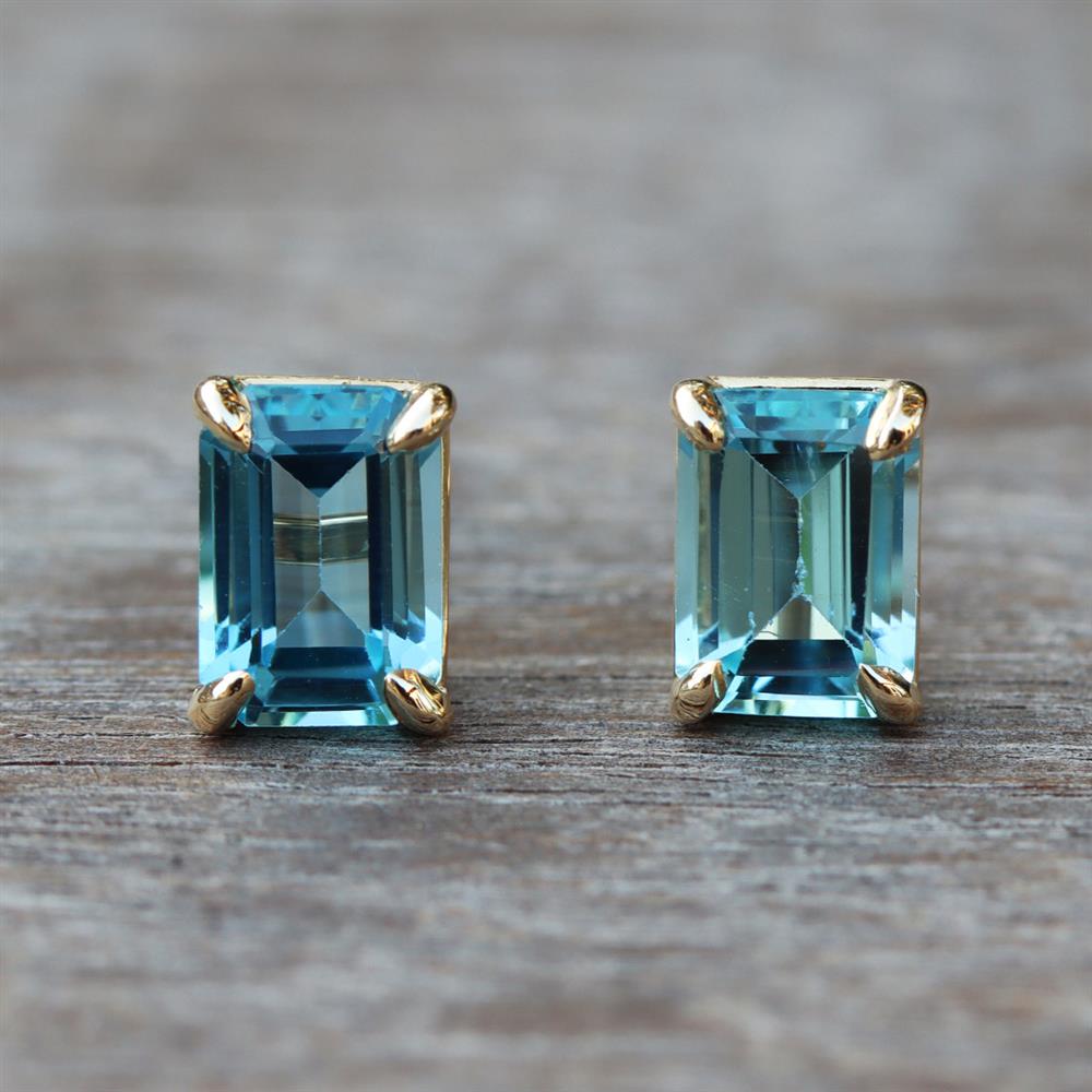 Swiss Blue Topaz Emerald Cut Stud Earrings in 14k Yellow Gold