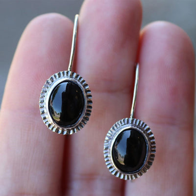 Oval Onyx Burst Halo Earrings in Sterling Silver