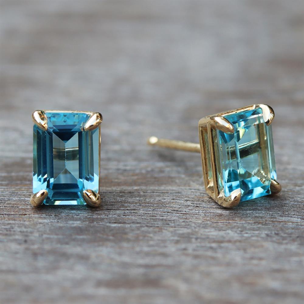 Swiss Blue Topaz Emerald Cut Stud Earrings in 14k Yellow Gold