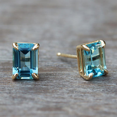 Swiss Blue Topaz Emerald Cut Stud Earrings in 14k Yellow Gold