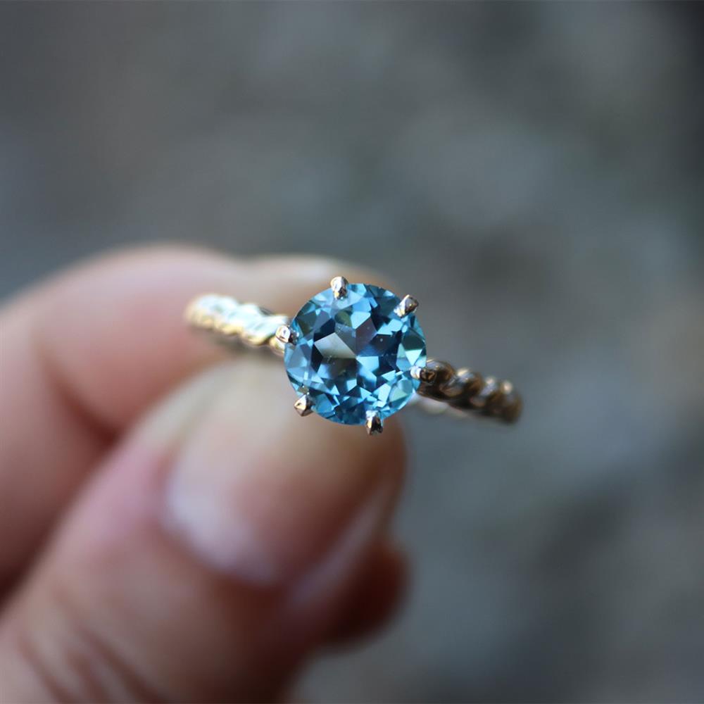 Swiss Blue Topaz Twist Ring in Sterling Silver