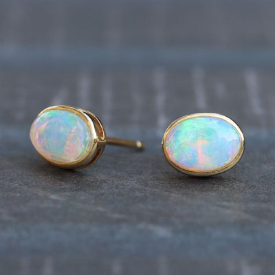 Oval Opal Stud Earrings in 14k Yellow Gold