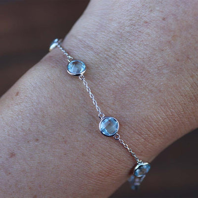 Bejeweled Blue Topaz Station Bracelet in Sterling Silver