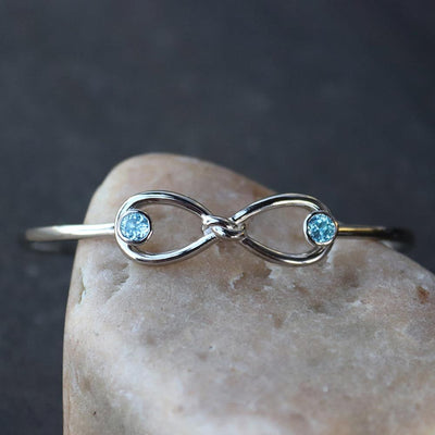 Blue Topaz Infinity Knot Bangle Bracelet in Sterling Silver